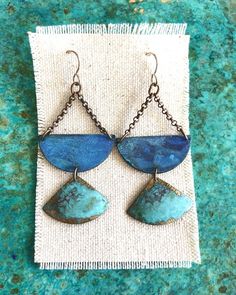 Oxidized brass in beautiful sky blue and verdigris patina finish earrings hang from oxidized sterling silver ear wires.  Measurements:2.5”x1.25” Blue Artisan Copper Earrings, Artisan Blue Copper Earrings, Unique Blue Copper Earrings, Blue Brass Dangle Earrings, Artisan Blue Nickel-free Earrings, Blue Teardrop Copper Earrings, Blue Copper Teardrop Earrings, Blue Oxidized Dangle Jewelry, Copper Dangle Jewelry With Patina