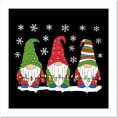 three christmas gnomes sitting on top of a snow covered ground with snowflakes