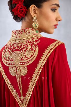 Editor's Note Featuring a bright red heavy golden embroidered yoke shirt having gathers along with embroidered dori in silk crepe Color: Red Fabric: Silk crepe Components: Shirt and dhoti Embroidery details: Hand embroidery, dori and hand adda work Fit: Relaxed Occasion: Festive and Wedding Guest Care: Dry Clean Only About the Designer Torani by Karan Torani stands handcrafted luxury inspired by the myriad tales of Indian mythology. Torani is a potpourri of all things nostalgic that binds you wi Dori Designs For Kurti, Dori Work Embroidery Design, Dori Designs, Diwali Inspiration, Long Kurti Patterns, Yoke Shirt, Dori Embroidery