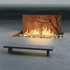 a fire place with a bench in front of it that is lit and has rocks on the ground