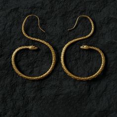 This Vintage-Inspired Serpent Design Pharaoh Round Earrings are made of high-quality alloy, showcasing a unique Egyptian flair and exquisite craftsmanship. The size of the earrings is as shown in the third image, making them perfect for various occasions--whether for everyday wear or special events, they will ensure you stand out. The distinctive serpent design symbolizes agility and strength, blending vintage and modern elements to highlight your personality and taste. Let these earrings add a Gold Snake-shaped Jewelry With Pierced Ears, Handmade Gold Snake-shaped Earrings, Gold Snake-shaped Earrings With Pierced Ears, Handmade Elegant Snake Earrings, Handmade Gold Snake Earrings, Gold Snake Jewelry For Pierced Ears, Elegant Handmade Snake Earrings, Gold Snake-shaped Earrings For Gift, Cool Snakes