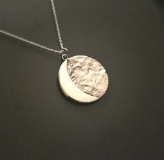 A moon quarter pendant from solid sterling silver hand carved using the lost wax method. width: 26mm / 1.02inch comes on a 18 inch/ 45cm long black sterling silver chain.If you would like a 20 inch / 50cm long chain. >>I ship worldwide. All items are send through the greek postal system by a priority registered mail. I will send you a tracking number to keep track of your purchase. >>All items will be send in a gift box inside safe packaging. ♥ Shopping on Etsy is really easy ♥ : htt Sterling Silver Celestial Necklace With Polished Finish, Unique Moon-shaped Engraved Necklace, Unique Moon Shaped Engraved Necklace, Unique Engraved Moon-shaped Necklace, Unique Silver Moon Phase Necklace, Sterling Silver Crescent Jewelry With Polished Finish, Unique Silver Necklace With Moon Phase Detail, Unique Silver Jewelry With Half Moon Shape, Etched Sterling Silver White Gold Necklace