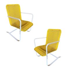 two yellow chairs sitting next to each other