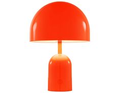 an orange table lamp on a white background