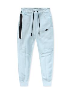 Upgrade your casual look with Nike Sportswear Tech Fleece Joggers. These joggers feature a slim, tailored fit with smooth, warm fleece and ribbed cuffs. The iconic paneled design, articulated knees, and taped pocket with an organizer offer both style and functionality. Made from a cotton-poly blend for comfort, they pair perfectly with the Tech Fleece hoodie. Light Blue Nike Joggers, Blue Nike Tech Fleece, Jean Hat, All Jordans, Tech Fleece Hoodie, Nike Sportswear Tech Fleece, Nike Tech Fleece, Fit Ideas, Nike Tech