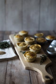 several mini pies on a wooden cutting board