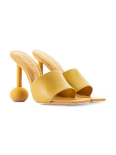 Part of Andrea Iyamah’s first-ever accessories collection, available exclusively at Industrie Africa, the Yuri Sandals make a modern statement with their minimalist backless silhouette and sculptural heels, accented with tonal spheres. They’re crafted from supple leather and feature open square toes and lightly padded insoles for comfort. The warm yellow hue is guaranteed to bring a ray of sunshine to any look. - Open square toe, backless design, lightly padded insoles, rubber soles - Leather - Sculptural Heels, African Luxury, Andrea Iyamah, Mesh Leotard, Statement Heels, Statement Shoes, Dr Shoes, Tube Necklace, Yellow Heels