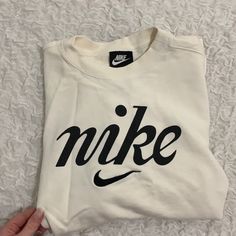 Vintage Nike Long Sleeve Terry Crop Sweatshirt Size Xs Color: Ivory/ Cream The Look Of The Sweatshirt Is Supposed To Be Vintage (Not Actually Vintage) Please Note: Very Viny Tiny Hole On The Shoulder Seam (Not Noticeable) Cricut Nike Sweatshirt, Sporty Logo Tops For Fall, Cream Logo Print Sweatshirt For Fall, Cream Sweatshirt With Logo Print For Fall, White Logo Sweatshirt For Spring, Casual Spring Sweatshirt With Logo, White Crew Neck T-shirt With Lettering, Casual Cream T-shirt With Logo Print, Cream Crew Neck Top For Streetwear