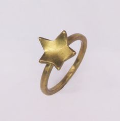 Delicate gold-coloured Star Stacker Rings. Perfect to wear alone and by stacking it with your other favourite rings. These lovely Star Stackings rings are available in brass (gold colour), silver or 18K gold plating. Size: UK A - UK Q Thickness: 1,5 mm Width: 2 mm Star detail: around 10 x 10 mm Please note: The 18K gold-plated jewellery will take 10 business days to prepare. The processing time for the silver and brass jewellery is 1-3 working days. Celestial Star-shaped Midi Rings As Gift, Adjustable Gold Star-shaped Rings, Adjustable Gold Star Ring, Minimalist Gold Star Shaped Rings, Minimalist Gold Star Rings, Wide Gold Ring, Silversmithing Jewelry, Triple Band Ring, Minimalist Silver Ring