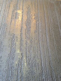 a close up view of the surface of a wooden table