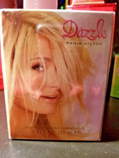 Product Details Dazzle is a new fragrance by Paris Hilton, presented in 2012 as a floral–fruity fragrance that “expresses Paris' whimsical side, revealing her inner beauty—dazzlingly and charming without the need for bling.”  "Give me a chance to color my world and I color it pink. A sparkling, sweet, pretty and playful pink, Dazzle, my newest fragrance, is about my world, me and all the different facets of my personality,” said Paris, adding "I love beautiful jewels and of course, pink diamonds Give Me A Chance, Thierry Mugler Alien, Color My World, Armani Si, Armani Code, Cologne Spray, Thierry Mugler, Elizabeth Arden, Womens Fragrances