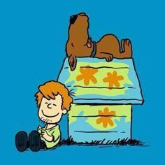 a boy and his dog are laying on top of a bed with flowers in it