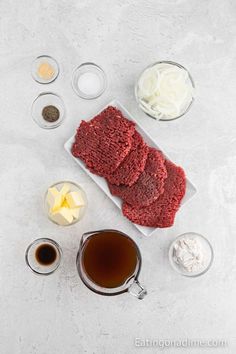 the ingredients to make this meatloaf recipe are laid out on a white surface