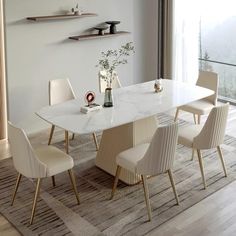 a dining room table with chairs around it