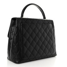 This is an authentic CHANEL Caviar Quilted Jumbo Kelly Flap in Black. This classic top handle bag is crafted of diamond-quilted caviar leather in black. The bag features a looping top handle, a rear patch pocket, and gold plated hardware as well as a matching Chanel CC turn-lock on the front facing flap. This opens to a black leather interior with zipper and patch pockets. Chanel Caviar, Handle Bag, Leather Interior, Patch Pocket, Top Handle, Top Handle Bag, Gold Plate, Black Leather, Chanel