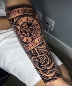 a man's arm with a clock and rose tattoo design on the left forearm