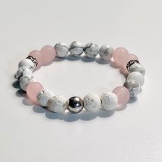 Essential Oil Aromatherapy Diffuser Beaded Bracelet. Made Semi-Precious Gemstones With White Howlite, White Lava Stone, Rose Quartz, Silver Hematite, Silver Spacers. Perfect For Any Occasion, Dressy Or Casual. You Can Also Mix And Match Several To Wear Together. ***Essential Oils Not Included*** Casual White Stretch Bracelet With Natural Stones, White Rose Quartz Beaded Bracelets As Gift, White Rose Quartz Beaded Bracelet As Gift, Handmade White Rose Quartz Bracelet, Adjustable White Rose Quartz Beaded Bracelets, White Casual Bracelet For Meditation, Casual White Beaded Bracelets With Natural Stones, Casual White Bracelet For Meditation, White Rose Quartz Beaded Bracelets For Healing