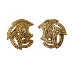 These vintage Crown Trifari clip-on earrings are a stylish addition to any jewelry collection. The gold tone base metal gives them a classic feel, while the brand name adds a touch of elegance. The clip-on closure ensures they can be worn comfortably by anyone without the need for pierced ears. 1" h by 0.75"w by 0.25" D    Perfect for a night out or to add a touch of glamour to an everyday outfit, these Trifari earrings are a must-have for vintage jewelry enthusiasts. Classic Metal Clip-on Earrings For Evening, Clip-on Yellow Gold Earrings, Gold Metal Clip-on Earrings For Formal Occasions, Retro Gold Earrings For Evening, Vintage Gold Hoop Earrings For Evening, Retro Gold Evening Earrings, Formal Gold Brass Clip-on Earrings, Chic Gold-tone Clip-on Earrings, Retro Gold Metal Earrings