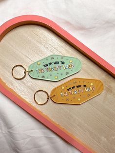 two wooden keychains that say, only way to the thrift shop