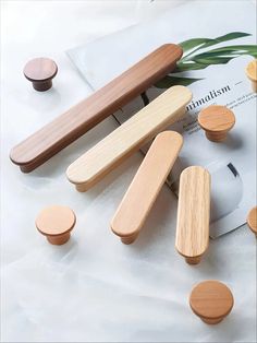 wooden knobs and pulls on top of a magazine