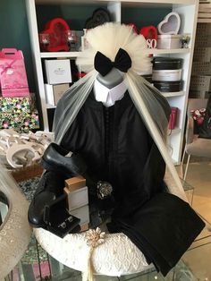 a mannequin dressed in black and white clothing