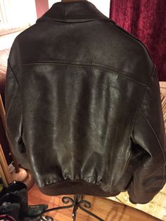 "This vintage jacket is warm and will help keep the weather out. Quilted lined for warmth and a beautiful dark brown color, the leather is aged and shows vintage wear for a perfect worn in look. Men's size 50 tall -Model size men's Large Approximate measurement when laid flat: 28\" armpit to armpit 21\" shoulder to shoulder 27\" sleeve 29\" back of collar to hem" Rugged Brown Outerwear With Padded Collar, Classic Brown Leather Jacket With Padded Collar, Classic Brown Leather Jacket For Winter, Classic Winter Leather Jacket In Distressed Brown, Classic Distressed Brown Leather Jacket For Winter, Classic Brown Outerwear With Padded Collar, Vintage Brown Leather Jacket With Pockets For Winter, Vintage Brown Leather Jacket For Outdoor, Vintage Distressed Brown Outerwear With Pockets