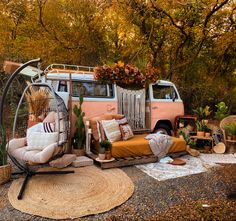 an old vw bus converted into a hammock bed in the middle of a forest