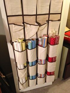 an organized closet with several rolls of toilet paper on the bottom and one roll in the middle