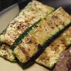 grilled zucchini and meat on a plate