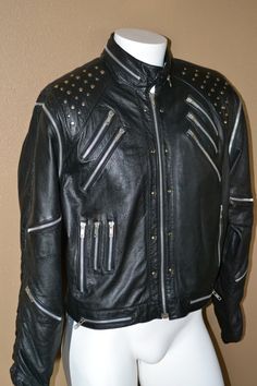 Awesome 1980's-1990's vintage leather jacket that is way cooler than even Michael's red one- minty vinty! Zip up front. Very stylish and definitely manly.  Studded black leather with genuine YKK zippered pockets everywhere. Sleeves can be zipped off while riding or whatever to convert to a killer vest. Fully lined inside. Leather is soft and supple. Even better than Harley Davidson could come up with :) BRAND LABEL- "METAL Size 44 857 Made in Korea" Great vintage condition-  No issues or odors. Retro Biker Jacket With Zipper For Biker Events, Retro Biker Jacket With Zipper Closure, Vintage Winter Biker Jacket With Zipper, Vintage Biker Jacket With Zipper For Biker Events, Vintage Biker Jacket For Streetwear With Zip Detail, Retro Biker Jacket With Zipper Closure For Streetwear, Retro Leather Jacket For Biker Events In Winter, Vintage Biker Jacket With Zipper For Streetwear, Retro Leather Jacket With Zipper For Biker Events