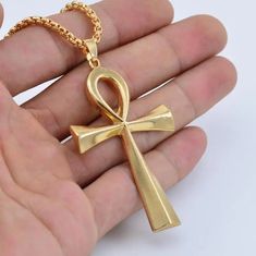 Adorn yourself with the timeless symbol of life and prosperity - our Zinc Alloy Big Ankh Cross Necklace. Crafted with intricate detail and durability in mind, this necklace features a bold representation of the iconic Ankh Cross, a revered emblem from ancient Egypt. The zinc alloy construction ensures both sturdiness and style, allowing you to wear this piece as a striking tribute to the rich heritage and mystique of Egypt. Metals Type: Zinc alloy Chain Type: O-chain We ship worldwide to 185 cou Egypt Necklace, Metal Symbol, Ankh Symbol, Symbol Of Life, Ankh Cross, Ankh Necklace, Crucifix Necklace, Necklace Cross, Life Symbol