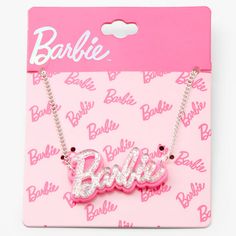 the barbie name necklace is on display in a pink box with white letters and silver chains