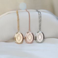 "If you choose the \"Picture\" option, we'll put the image on the locket.  Use the \"contact shop owner\" button to send us the picture, or you can email it to hoiaucraft@outlook.com. (We can put up two pictures) HOW TO ORDER? Please indicate your engraving birth flower or Initial & the chain typr on the Personalized box. For example: 1, Engraving: Flower: Rose Or Initial: A 2, Box chain ♥ D E T A I L S ♥ ---Locket Size: 23mm * 30mm ---Come with Individual Gift Box. READY TO GIFT. ---All items are handmade with love, Custom items do take a little extra time to create. Our turn around time is about 5-10 business days. ♥ TIPS FOR TAKE GOOD CARE ♥ --Keep it in a dry place. Please take it off before bathing, exercising, swimming. --Don't wear it in the pools, the ocean or in hot tubs. --Keep p Elegant Oval Link Locket Necklace For Wedding, Wedding Locket Necklace With Oval Link, Victorian Jewelry With Engraving Option For Gifts, Oval Locket Necklace With Adjustable Chain As Gift, Rose Gold Oval Locket Necklaces, Medallion Locket Necklace With Adjustable Chain For Weddings, Oval Locket Jewelry For Gift, Oval Link Locket Jewelry For Wedding, Oval Link Locket Necklace For Wedding