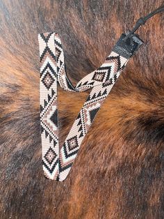 a brown and black animal fur with a leash on it's side, showing the pattern