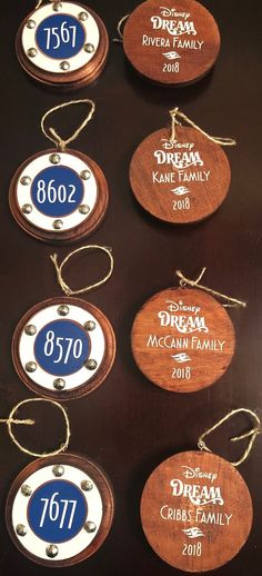 wooden ornament with disney family names and date printed on them for guests to sign