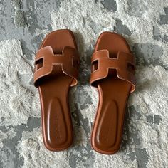 Tan, Faux Leather With White Stitching. Slip On Sandal. Never Worn, Fit Is Tts. Brown Flat Sandals For Day Out, Casual Tan Synthetic Sandals, Brown Leather Summer Mules, Brown Flat Heel Sandals For Day Out, Casual Tan Open Toe Sandals, Casual Open Toe Tan Sandals, Tan Synthetic Open Toe Sandals, Casual Tan Flat Sandals, Casual Tan Flat Heel Sandals