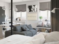 a bedroom with white walls and grey curtains