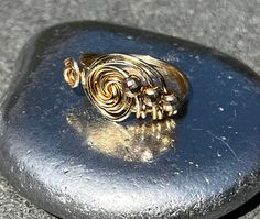 Gold Bypass Ring With Modern Twist For Gift, Modern Twist Gold Bypass Ring As Gift, Gold Spiral Jewelry, Gold Spiral Bypass Ring As Gift, Gold Hand Wrapped Toe Ring, Adjustable Gold Toe Bypass Ring, Adjustable Spiral Gold Jewelry, Gold Spiral Ring With A Modern Twist, Gold Swirl Wire Wrapped Jewelry