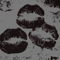 black and white photograph of lipstick on grey background