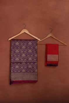 Radiate elegance on festive occasions in this beautiful purple Katan silk Banarasi saree with zari work. The saree has a pink edging. It comes with a matching blouse piece. Disclaimer: The shown stitched blouse on the model is for display purpose only. The saree comes with a matching blouse piece and finished with fall and piko. Disclaimer: The actual product may vary slightly from the image. These are custom orders, hence expect slight variation in color, placement of the motif or buta. ESTIMAT Purple Katan Silk Saree With Border, Purple Banarasi Silk Saree With Border, Purple Art Silk Saree With Border, Purple Saree With Border In Traditional Drape, Festive Purple Banarasi Silk Dupatta, Purple Banarasi Silk Dupatta For Festive Occasions, Purple Traditional Wedding Wear With Border, Purple Art Silk Traditional Wear With Border, Purple Jamawar Dupatta For Puja