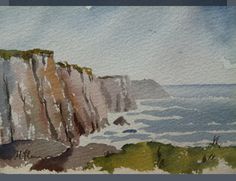 watercolor painting of cliffs and the ocean