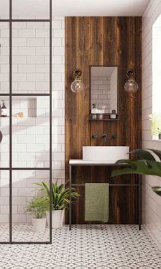 a bathroom with white tile and wooden walls, green plants in the corner near the sink