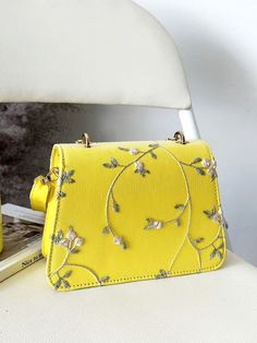 Bag For Love - Leaf Embroidered Faux Pearl Decor Flap Square Bag - Women Satchels Product Description Color Yellow Strap Type Adjustable Pattern Type Floral Style Fashionable Bag Size Small Quantity 1 piece Details Embroidery Details Pearls Type Square Bag Composition 100% Polyurethane Material PU Leather Size Chart INCH CM Size Bag Width Bag Height Bag Length Strap Length one-size 2.8 5.3 7.5 47.2 Size Bag Width Bag Height Bag Length Strap Length one-size 7 13.5 19 120 Similar Products h2 { tex Trendy Embroidered Shoulder Bag For Spring, Spring Embellished Rectangular Bag, Spring Embellished Shoulder Bag, Spring Party Bag With Floral Embroidery, Spring Party Bags With Floral Embroidery, Yellow Embroidered Rectangular Bag, Spring Embroidered Bag, Embroidered Crossbody Bag For Spring, Spring Floral Embroidery Crossbody Bag