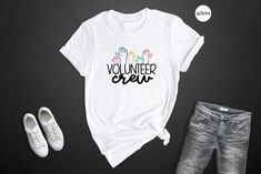 Are you looking for the perfect gift for him that's both meaningful and stylish? Look no further! Our Volunteer Crew Shirt is the ideal gift for any man who loves giving back and making a difference.He can wear it proudly to show off his commitment to volunteer work, or just to add an extra touch of style to his wardrobe. No matter what cause he is passionate about, this Volunteer Work Tee makes a meaningful and thoughtful gift. So surprise him with a piece of apparel as meaningful as his volunt Volunteer Shirt, Volunteer Work, Teacher Tees, Perfect Gift For Him, Crew Shirt, Graphic Tees, Gender Neutral, Adult Outfits, Tops & Tees