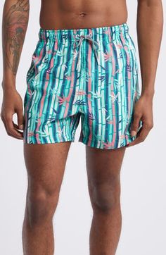 Get your daily dose of vitamin Sea and throw on these mid-length, quick-drying swim trunks in an exclusive print that's sure to catch the eye. 4 1/2" inseam; 25" leg opening; 12" front rise (size Medium) Elastic/drawstring waist Side-seam pockets; back hook-and-loop patch pocket with drainage grommet Mesh liner 100% REPREVE® recycled polyester REPREVE recycled polyester is made from 100% post-consumer recycled plastic bottles Machine wash, tumble dry Imported OEKO-TEX®–certified materials free o Green Printed Swim Trunks For Beachwear, Green Printed Swim Trunks Beachwear, Green Printed Beachwear Swim Trunks, Green Printed Swim Trunks For Poolside, Casual Green Swim Trunks With Upf 50+, Green Hawaiian Swim Trunks For Swimming, Green Hawaiian Style Swim Trunks For Swimming, Hawaiian Style Green Swim Trunks, Green Swim Trunks With Upf 50+ For Vacation