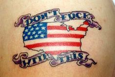 an american flag tattoo on the back of a woman's thigh