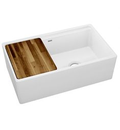 a white sink with a wooden cutting board in it