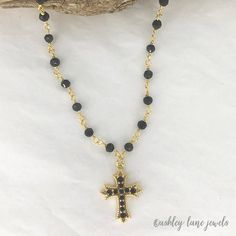 ROMANESQUE Gold & Black Rhinestone CROSS  Necklace * Simple * Minimal * Black Crystal Beaded Chain * Pave Cross Necklace Available in 12", 14", 16", 18" or 20" - each comes with a 3" extender (12" is choker length or for a very small neck) MATERIALS: Black and gold beaded chain has 4mm beads.  Gold/black rhinestone cross is 19x25mm and is gold plated.  All components are gold plated.  See the photo with a ruler for size. CARE: Water/moisture and perfume are what cause most tarnishing - so the necklace needs to be stored in a dry place and not worn in the shower. Limiting perfume in the neck area will also prolong the life of the necklace. MADE TO ORDER - Currently production time is 1-3 days Ships in a gift box. Black Crucifix Jewelry For Jewelry Making, Black Jewelry With Adjustable Chain And Cross Pendant, Black Cross Jewelry With Adjustable Chain, Black Beaded Cross Necklace, Black And Gold Cross Necklace, Black Adjustable Necklace With Cross Pendant, Adjustable Black Beads Cross Necklace, Elegant Black Crucifix Cross Necklace, Black Adjustable Cross Pendant Jewelry