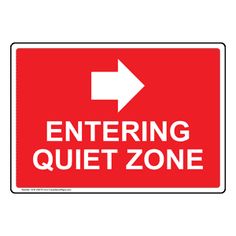 a red and white sign with an arrow pointing to the right that says entering quiet zone