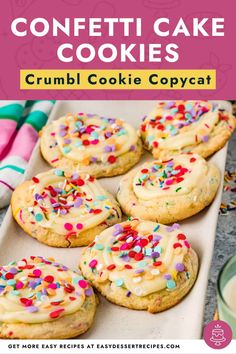 some cookies with white frosting and sprinkles on top